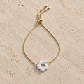 Bracelet doré pampille beige